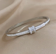 Load image into Gallery viewer, Exquisite Stainless-Steel Bangle with Crushed Zirconia and Secure Lock Clasp.
